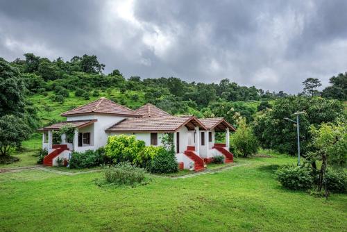 SaffronStays Sattva 2BR Konkani style eco farmhouse with wood fired copper baths orchard forest walks & stargazing — 4-Star Luxury Hotel in Pen, India