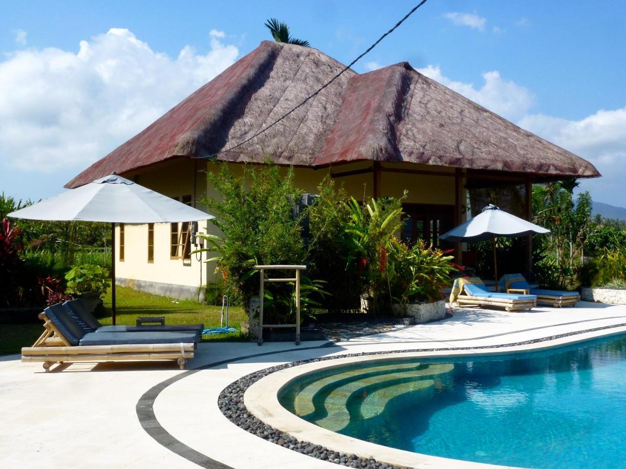 Two Smiling Buddhas in Amlapura, Indonesia