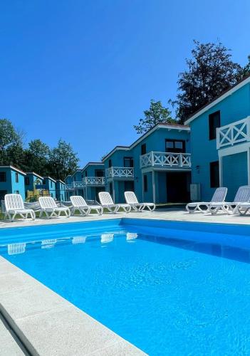 Domki przy plaży Owocowy Ogród in Rewal, Poland