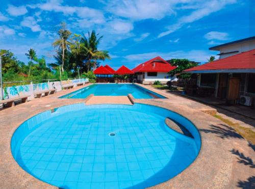 Cockatoo Pool & Beachfront Transient Your Relaxing Family Getaway by the Sea — 4-Star Luxury Hotel in Puerto Princesa, Philippines