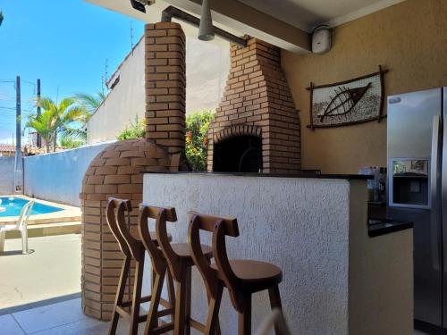 Sobrado Itanhaém 3 suítes com ar condicionado in Itanhaem, Brasil