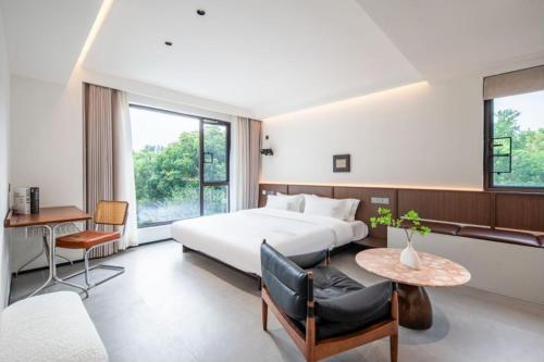 Wuzhen Xizha yiyuqinghuan minsu — hotel in Wuzhen