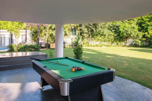 StayVista’s The Secret Lagoon with Outdoor Pool Verdant Lawn & Indoor Outdoor Activities