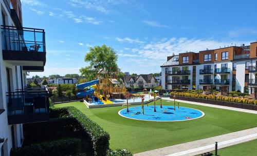 Family SUN & FUN Apartment & Water Park Patio at Belmare Aqua Resort in Miedzyzdroje, Poland