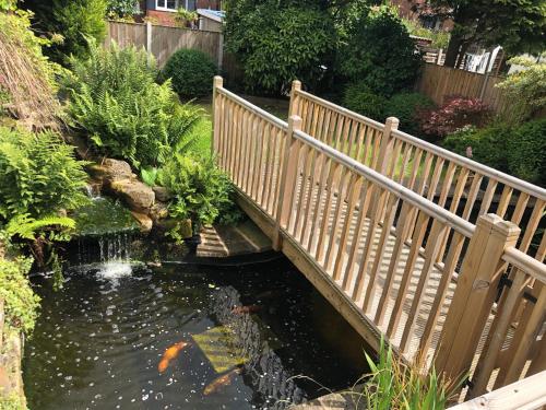 Rest & Recharge Koi House — 4-Star Luxury Hotel in Oldham, United Kingdom