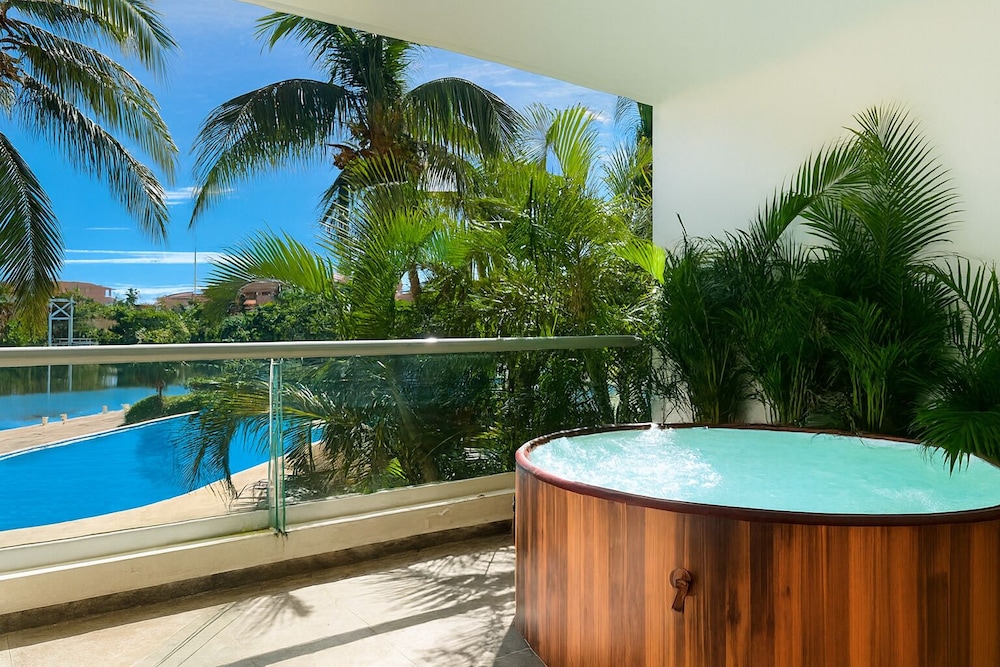 High End Waterfront Condo at Secrets Waters — 4-Star Luxury Hotel in Puerto Aventuras, Mexico