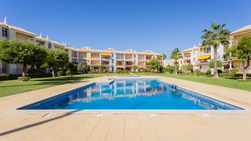 Serene Apartment W Balcony and Pool by LovelyStay — 4-Star Luxury Hotel in Quarteira, Portugal