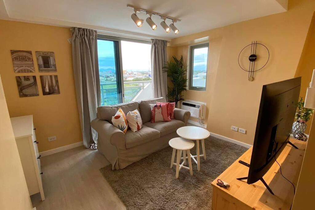 Two Bedroom with Balcony by The Bali Corner at Azure North POOL and BEACH VIEW unit with Bathtub — 4-Star Luxury Hotel in San Fernando, Philippines