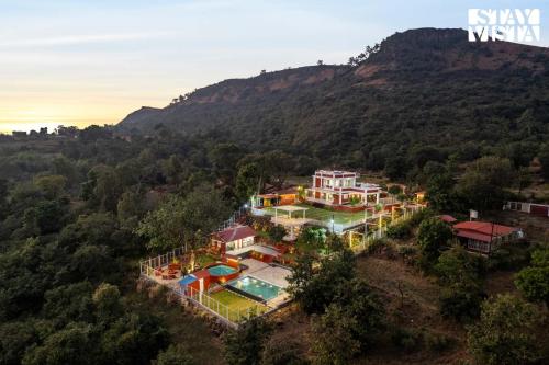 StayVista at The Redstone Villa with Bar Lawn & Pool — 5-Star Luxury Hotel in Kolhapur, India