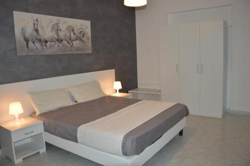 Helios Rooms — 4-Star Luxury Hotel in Quartu Sant'elena, Italy