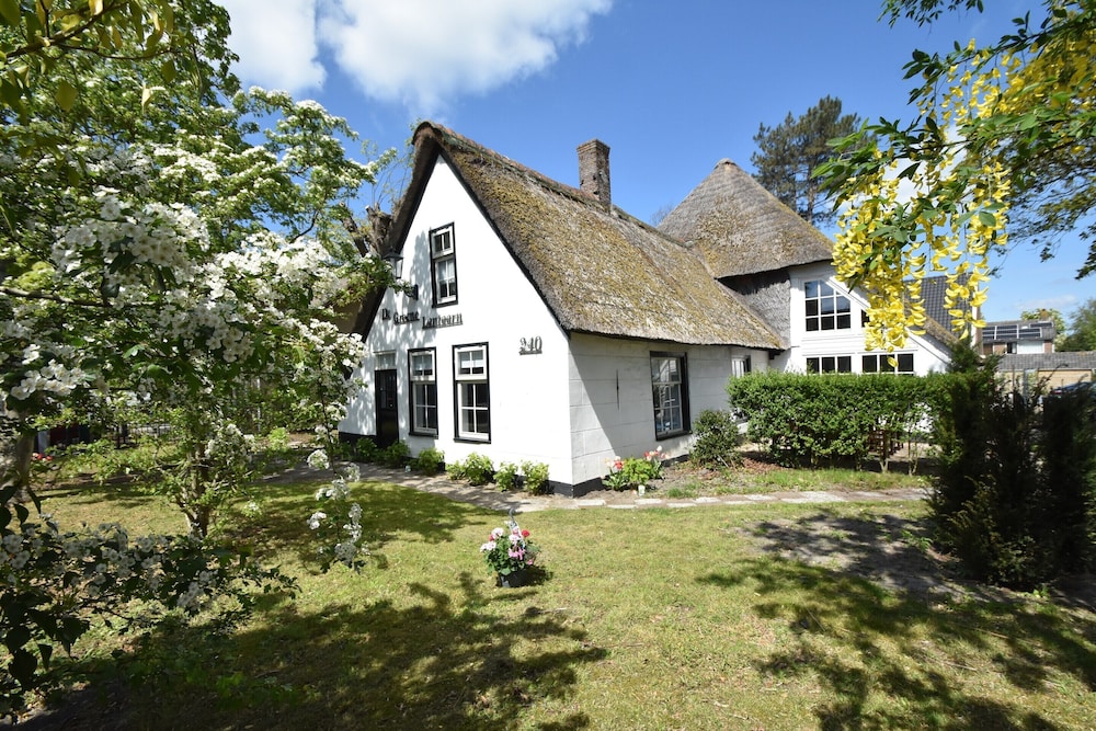 Luxuriously restored farmhouse with trendy interior close to sea and forest — 4-Star Luxury Hotel in Bergen, Netherlands