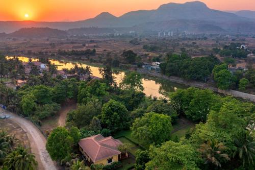 Vintage Estate Lakeside allure with vintage decor A plunge pool & A lawn featuring a charming gazebo in Karjat, India