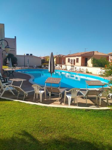 Villetta Soleil con Piscina e Campo da Tennis condominiale in Villasimius, Italy