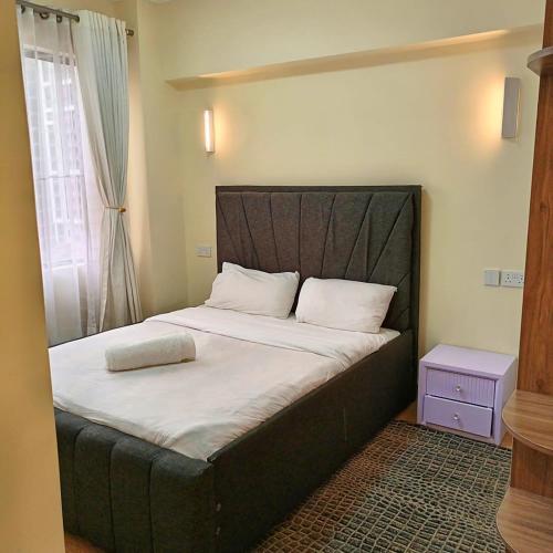 Enzi heights luxurious 2 bedroom furnished and serviced apartment with a poolgym and playground