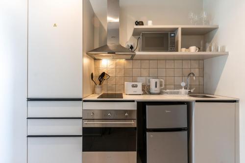 The Rose 107: Modern Corner Unit with Balcony