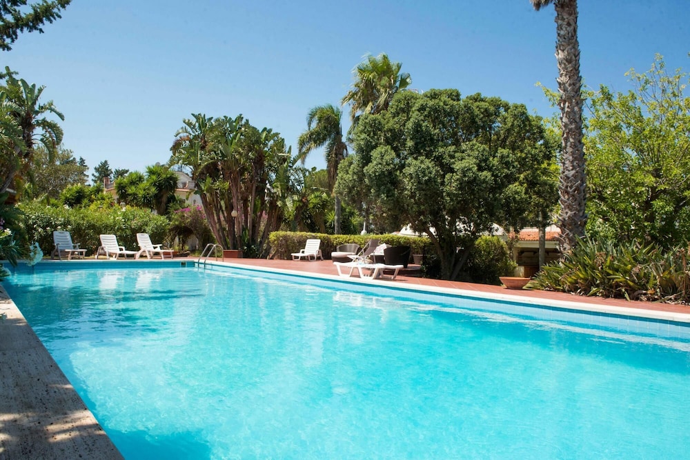 Una Scogliera Sul Mare Con Piscina by Wonderful Italy in Terrasini, Italy