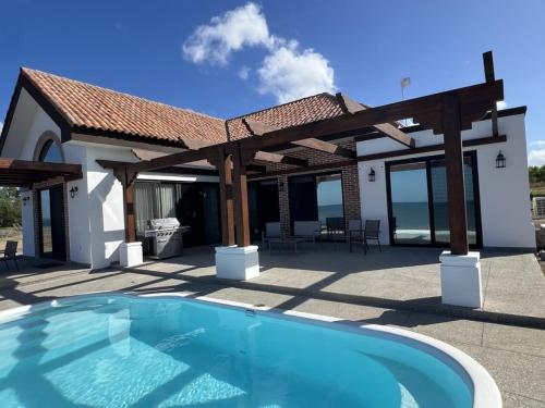 Forever Sunsets Beachfront 3BR Home with Private Pool at Gran Pacifica Resort in Unknown City, Nicaragua