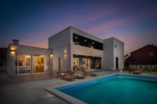 Villa with pool near sandy beach by TRAVELER tourist agency Krk ID 2224 — 4-Star Luxury Hotel in Privlaka, Croatia
