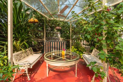 SaffronStays Birdsong 3BR pet friendly villa with lawns treetop terraces gazebo dining & tennis court
