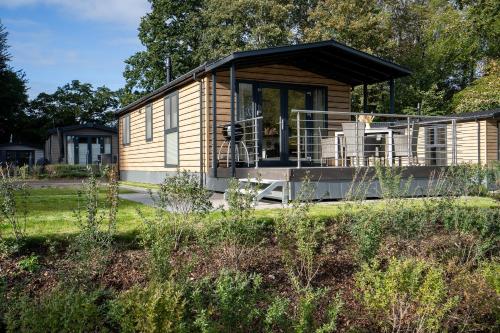 Ostseecamp Lübecker Bucht Haus Morgensonne mit überdachter Veranda — 4-Star Luxury Hotel in Scharbeutz, Germany