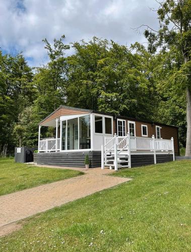 Percy Wood Lodges with Hot Tubs in Amble, United Kingdom