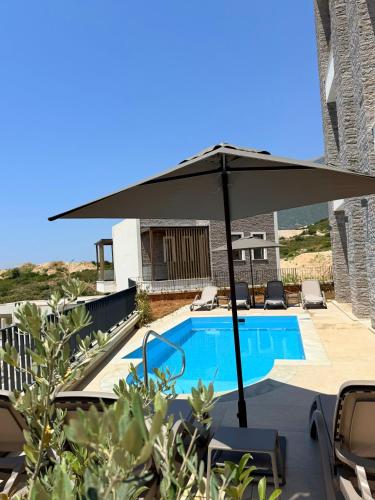 Turquoise Pool Side Thymus Resort - carbon neutral hotel in Himare