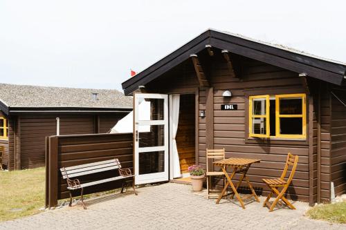 A Small Wooden Hut In A Large Community in Ulfborg, Denmark