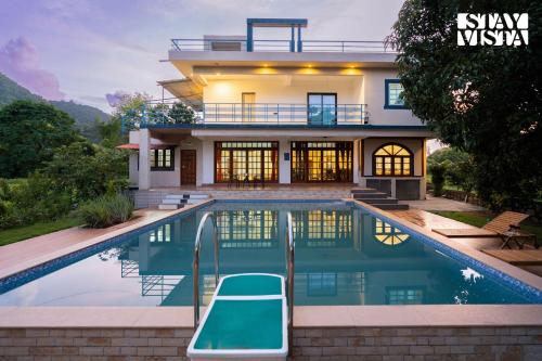 StayVista at FarmVille with Mountain View Pool in Alibag, India