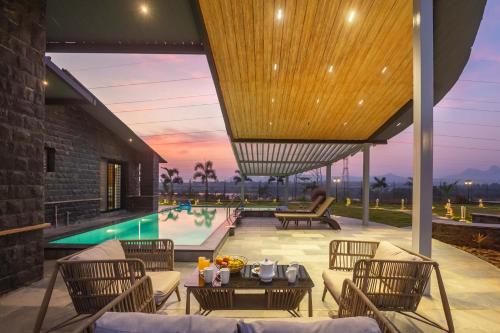 StayVista’s Le Ciel Lakeside Retreat Amidst Farmland with Pool Indoor Activities Lawn Bonfire Pit & Ample Seating Space in Nashik, India