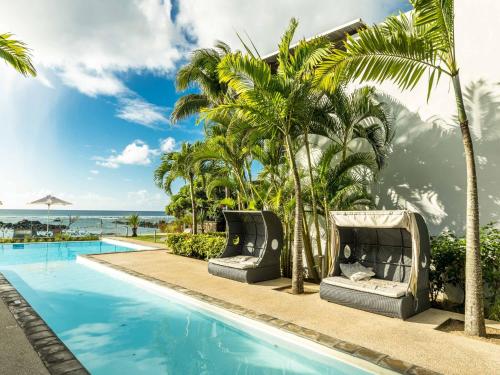 Beachfront & Pool serviced apartment with stunning view closest to the beach than most hotel in Triolet, Mauritius