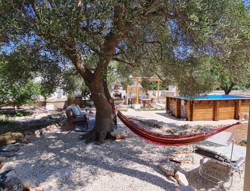 Trullo Serenità Retreat with relaxing pool area — 4-Star Luxury Hotel in Martina Franca, Italy