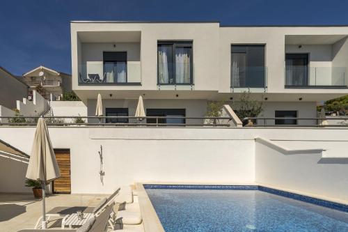 Seaside apartments with a swimming pool Rastici Ciovo 17889 — 4-Star Luxury Hotel in Trogir, Croatia