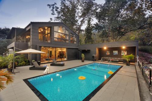 SaffronStays Earl Grey 3BR pet friendly pool villa with theatre pool table BBQ & glass balconies for open views — 4-Star Luxury Hotel in Khopoli, India