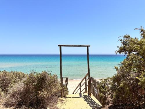 Blue shutters by the beach Access to private beach in Pula, Italy
