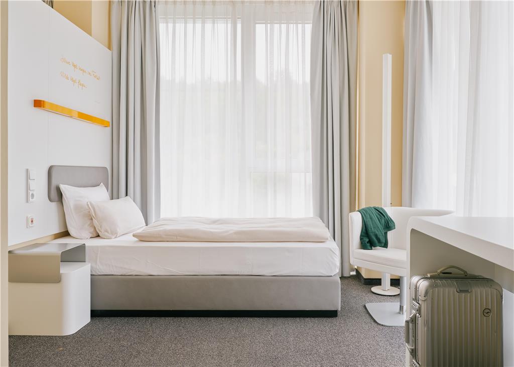 Handicapped room with two beds, desk, club chair, electric curtains, emergency call function