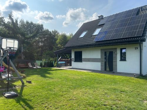 Mazury Dom Oskar nad jeziorem Sasek Wielki z jakuzzi in Szczytno, Poland