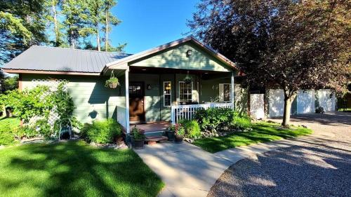 Whitefish Luxury Escape w hot tub fenced in yard in Whitefish, United States