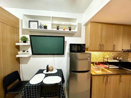 Kathys Crib with balcony Pool view at Shell Residence — 4-Star Luxury Hotel in Manila, Philippines