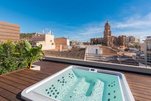 Exclusivo A tico Plaza ConstituciA3n by ELE Apartments — 4-Star Luxury Hotel in Malaga, Spain