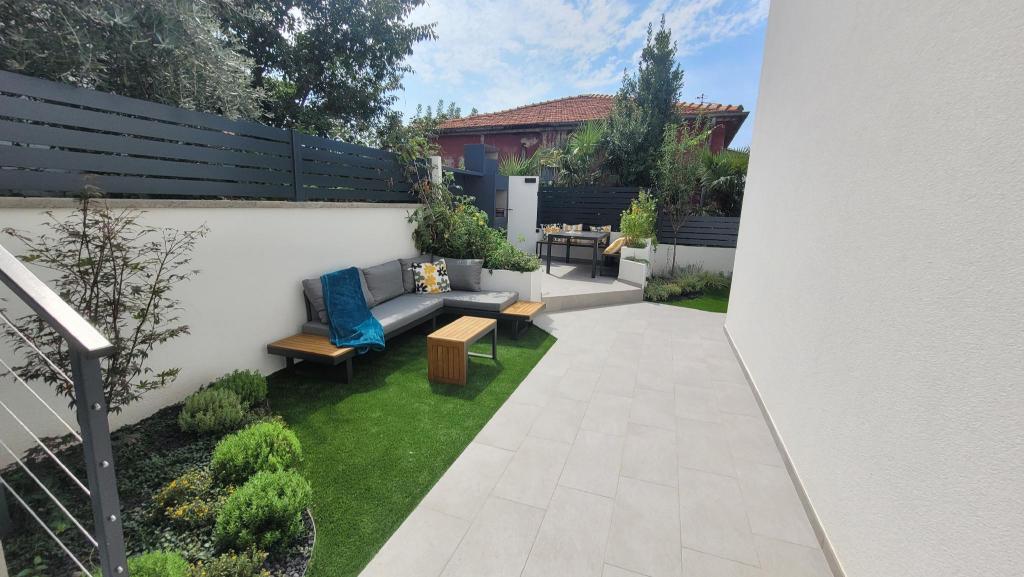Private fenced garden with BBQ area minutes from the beach Urban Secret Kantrida — 4-Star Luxury Hotel in Rijeka, Croatia