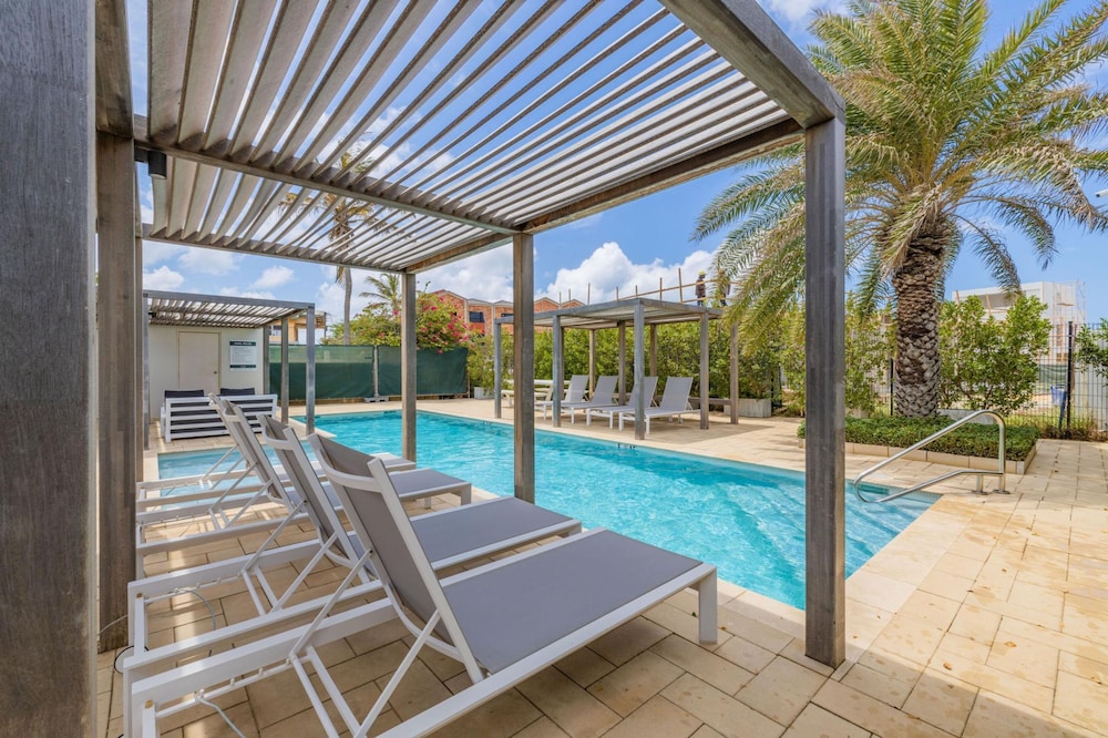 Serene Designer Gem Walk to Beach Strip Pool in Noord, Aruba