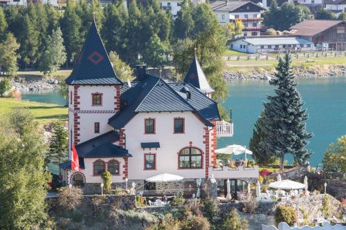 Hotel Schlossl Am See in Curon Venosta, Italy