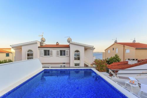 Seaside apartments with a swimming pool Rastici Ciovo 1084 — 4-Star Luxury Hotel in Trogir, Croatia
