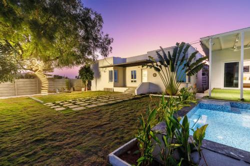 Serene Retreat by StayJadePoolBasketball Court — 4-Star Luxury Hotel in Hyderabad, India