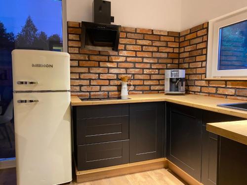 Domki trzy jeziora z zewnętrznym SPA sauna balia do schładzania i jacuzzi in Chojnice, Poland