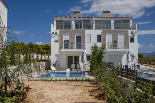 Enchanted Sunlit Villa Retreat — 4-Star Luxury Hotel in Isthmia, Greece