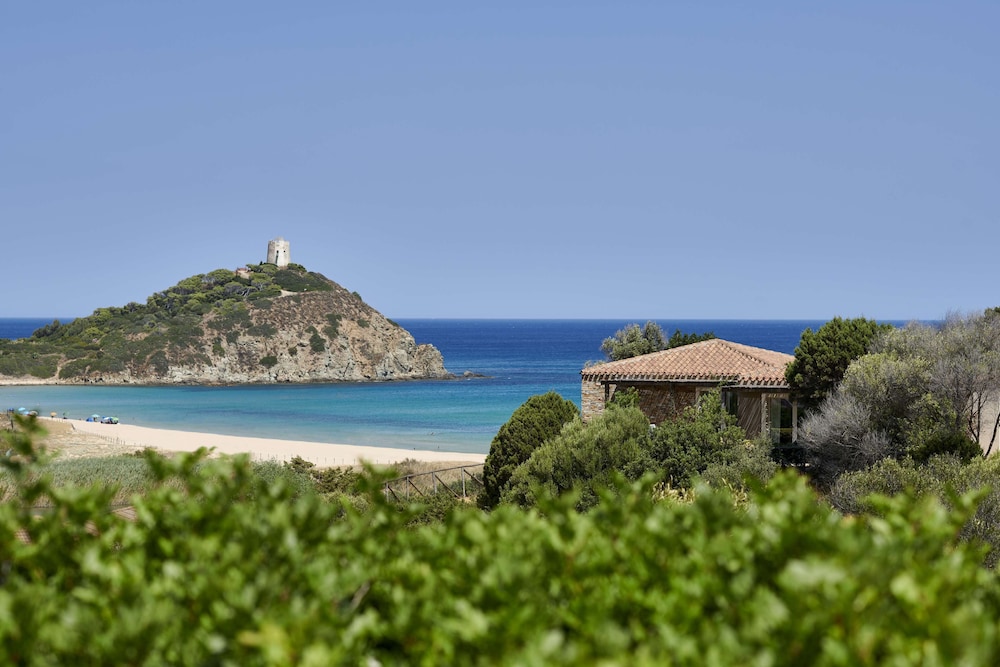 Baia di Chia Resort Sardinia Curio Collection by Hilton - carbon neutral hotel in Domus De Maria