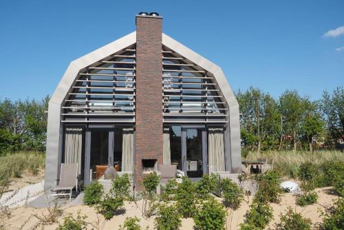 Zicht op de Molen by Droomvilla — 4-Star Luxury Hotel in Egmond Aan Zee, Netherlands