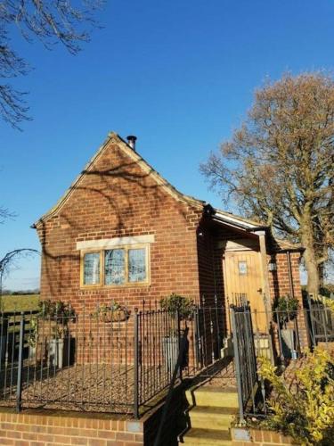 The Old Telephone Exchange surrounded by fields in Harrogate, United Kingdom