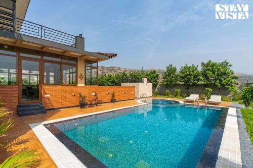 StayVista’s Shivoham Farms Mountain View Villa with Outdoor Pool Lawn and Terrace